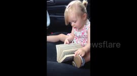 One-year-old reading out loud