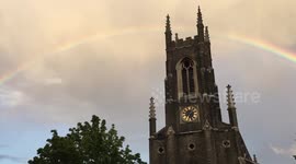 Complete rainbow over a church in Archway, London