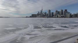 Lake Ontario at Toronto waterfront freezes over as cold weather continues in Toronto Canada