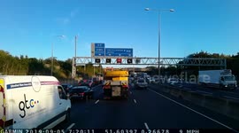 Two near misses with mobile crane. Rush hour on M25, A12 junction, Essex, England