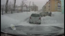 Russian drivers fight as one attempts snow from parking space