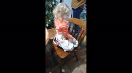 Alice ckeaning and singing to d olly Parton at ny mitgers house