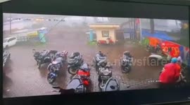 Violent winds topple billboards as intense rainstorm hits west Indonesia