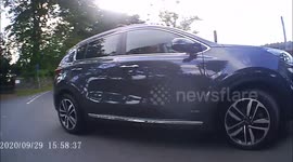 Near miss as driver of Kia Sportage pulls out on cyclist on Carlton Lane in Guiseley West Yorkshire