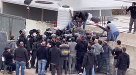Israeli soldiers scuffle with Palestinians during the demolishing of a Palestinian house belonging to Karameh family, in al-Tur neighborhood of East Jerusalem