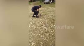 Kind man rescues stray cat with its head is stuck in can