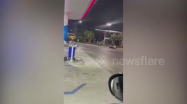 Escaped buffalo rampages through gas station in Thailand