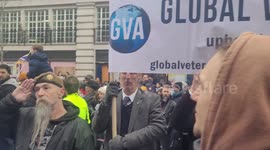 UK veterans line up to salute NHS staff marching through Piccadilly Circus