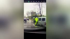 Motorist drags police officer along road as he attempts to avoid being checked