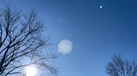 Kids entertain themselves by blowing bubbles and watching them freeze in Canada