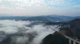 Dream-like clouds loom around Chinese highway