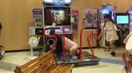 Japanese couple show off crazy skills on dance arcade game