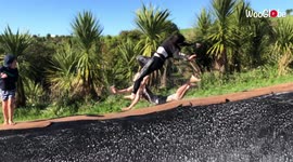 Double wipeout occurs as adults lose control on Slip ’N Slide
