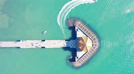 Drone Footage Of Speedboats speeding Past Huilan Pavilion In Quingdao, Shandong, China