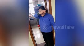 Excited mother wipes away tears as daughter surprises her by returning home for Chinese New Year