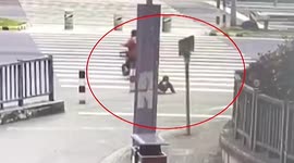 Toddler falls off scooter as mother drives it across road in China