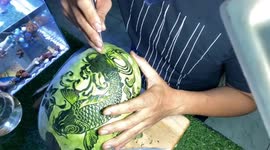 Vietnamese man carves beautifully detailed carp artwork into watermelon