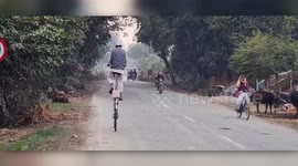 Riding high! Indian mechanic builds giant bike from scrap