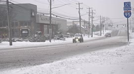 Post Road during  winter blizzard in January 2022 with cold weather and slippery road