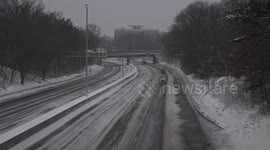 Traffic on I-95 during winter blizzard on East Coast in USA with slippery and snow covered highway