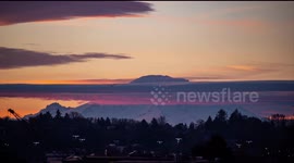 Watch this stunning time-lapse of Mount Rainier jutting out of a layer of cloud at dawn