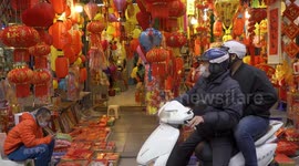 Residents of Hanoi, Vietnam enjoy traditional holiday market on the verge of the Lunar New Year