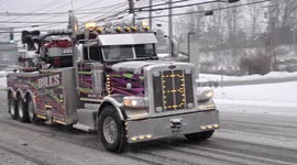 Big towing truck on Post Road in Norwalk, Connecticut as powerful Winter Storm Kenan slams into eastern US
