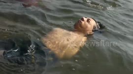 Boy born without arms beats the odds by swimming across river in southern India