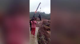 Car rolls back into farmland in China after driver forgets to put handbrake on
