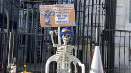Skeleton outside Downing Street mocks PM as 'partygate' report finally delivered