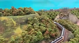 Adorable cats invade a miniature Japanese railway diorama