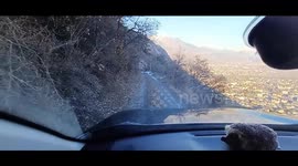 Dashcam shows slippery descent down icy steep mountain road