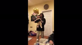 baby laughing uncontrollably playing with a balloon for the first time on New Years.