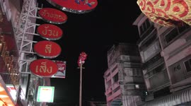 Chinese New Year Lion Dancer up a Pole unveils Happy New Year Banner