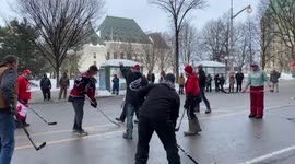 Canada: Truckers Protesting Vaccine Mandates In Ottawa Play Hockey On Street