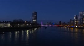 Night view of the river Thames from Millbank - the London Eye and Vauxhall Bridge