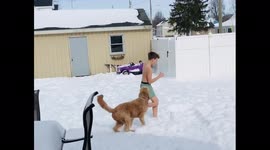 Layne lost a bet and had to run outside in the snow in his boxers the dog got in on it and tried to pull his boxers off