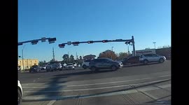 Several cars run a red light in Humble, TX on January 29, 2022