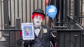 Protester dressed as Charlie Chaplin mocks Boris Johnson and the Tory Party outside Downing St