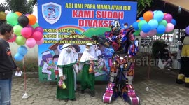 Indonesian police officers dress as cartoon characters to put children at ease during vaccinations