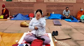 A Russian Buddhist lady praying by laugh for peace