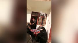 Chinese patients play mahjong with IV drips attached to them in clinic