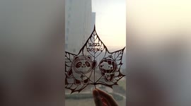 Chinese man carves mascots for the Winter Olympics into leaves
