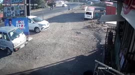 Truck skids around corner, flips over and ploughs into oncoming traffic in western India