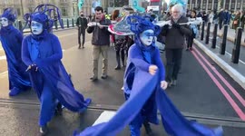 Activists carry a ‘whale’ across Westminster Bridge in protest against the destruction of oceans