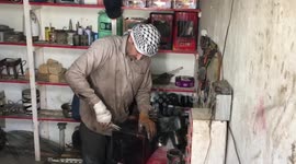 A young man from Gaza Strip recycles scrap metal with heaters to beat the extreme cold.