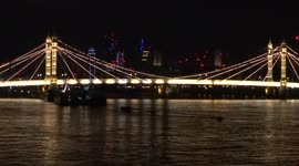 Beautiful night view of the river Thames with Chelsea Bridge and Albert Bridge - London