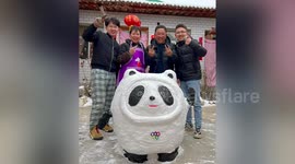 Family creates mascot for Winter Olympics out of snow in China