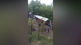At least 13 dead after tour bus plunges off Indonesian road
