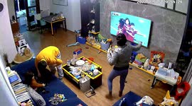 Excited mother scares daughter as she celebrates China women's football team's win